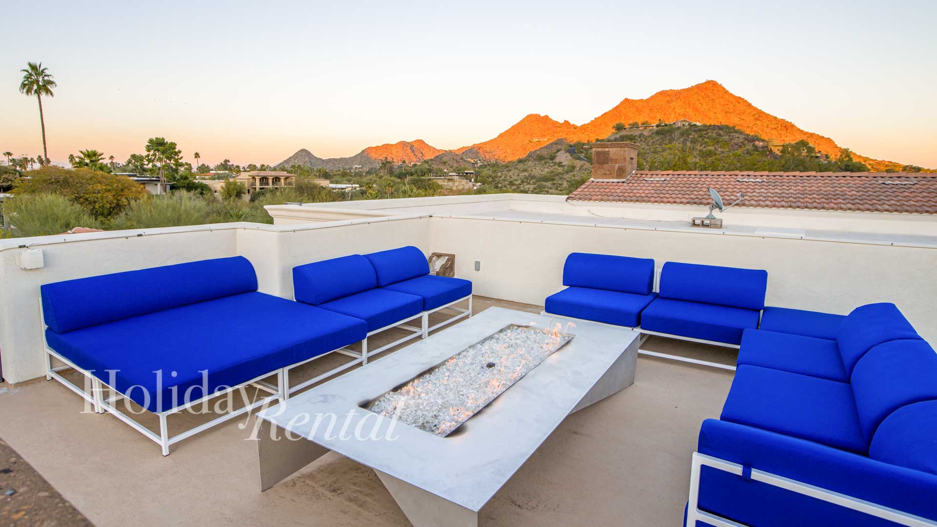luxury vacation rental rooftop patio with firepit and mountain views