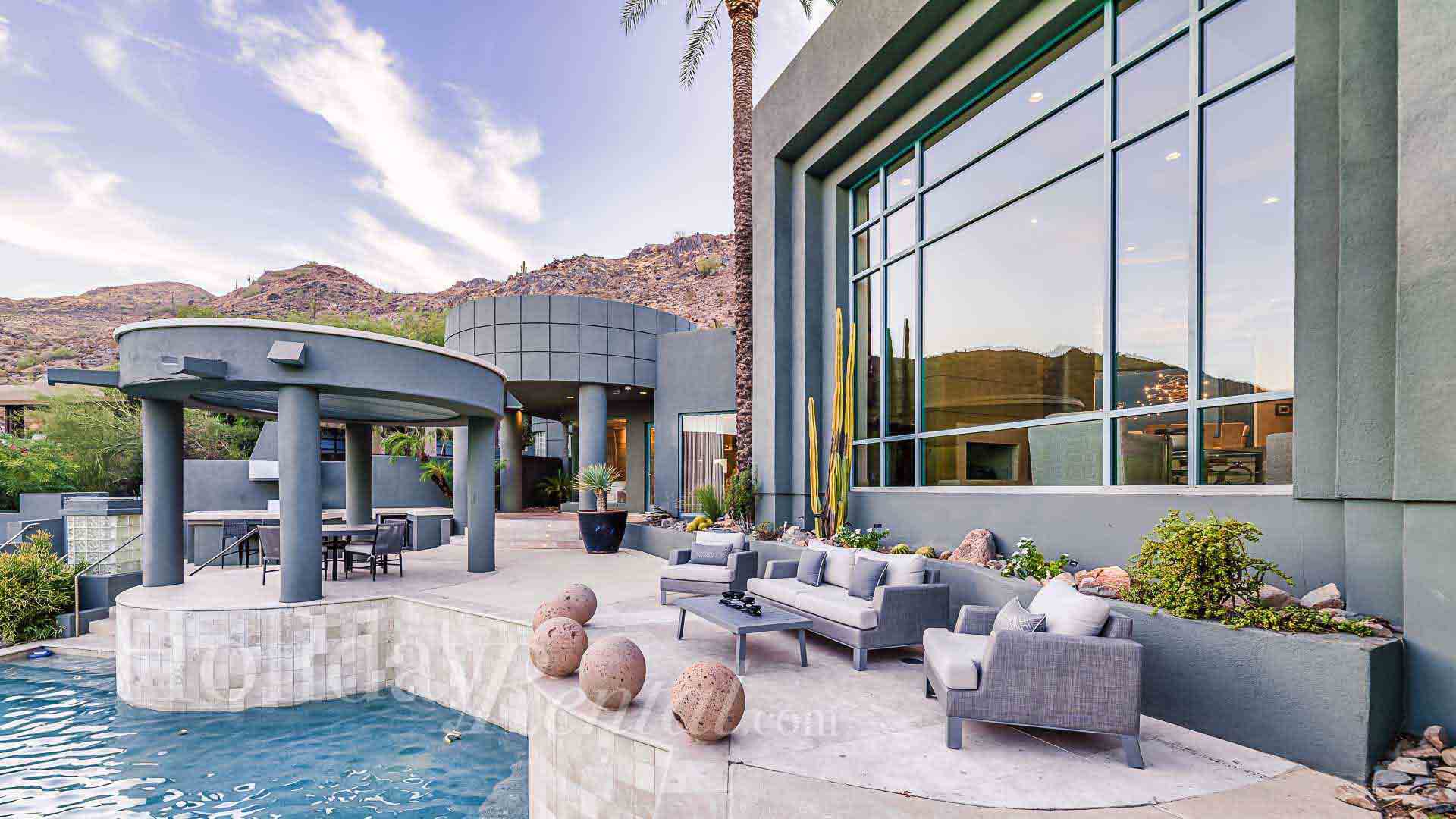 luxury vacation rental with poolside seating