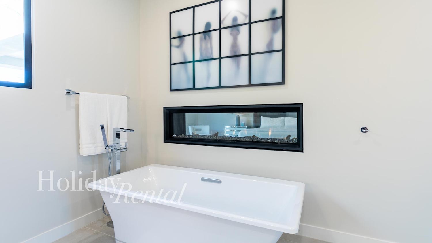 vacation rental master bathroom tub and fireplace