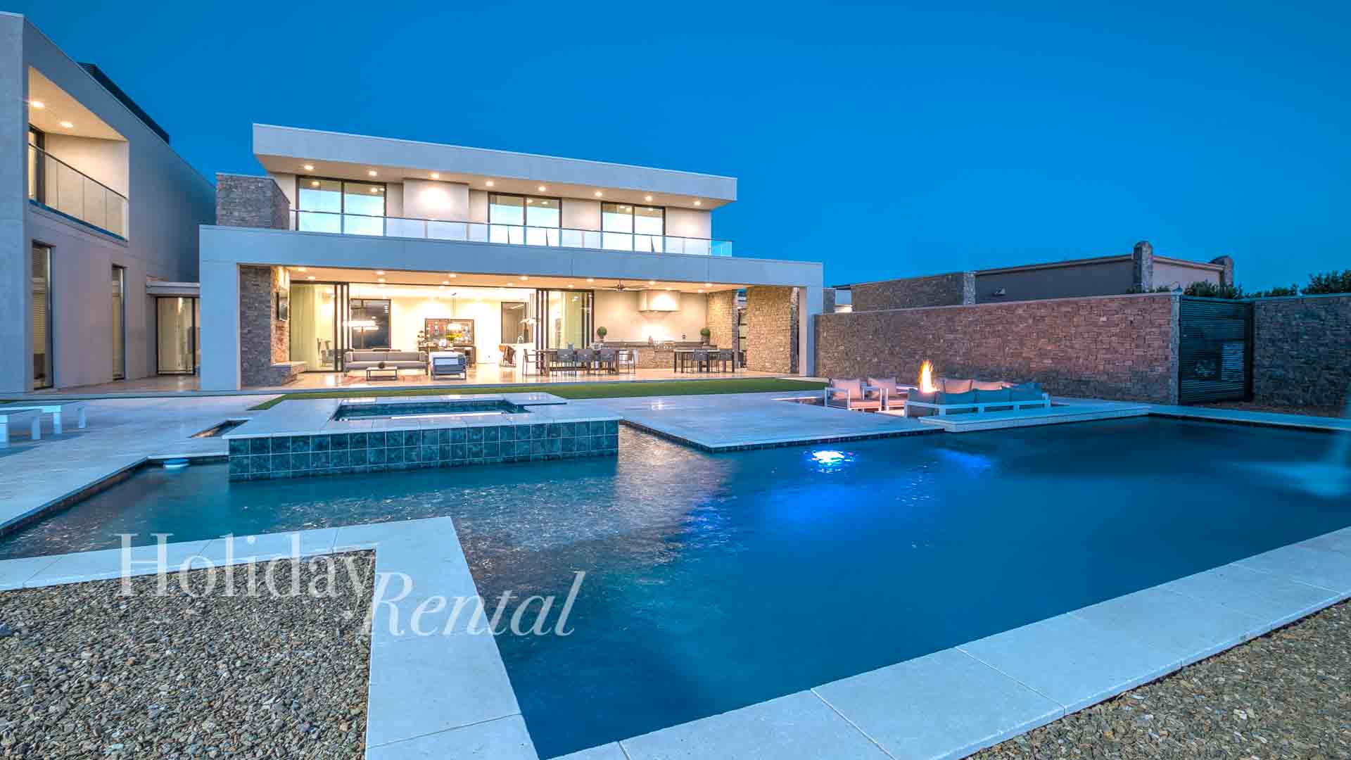 luxury vacation rental with a pool and firepit