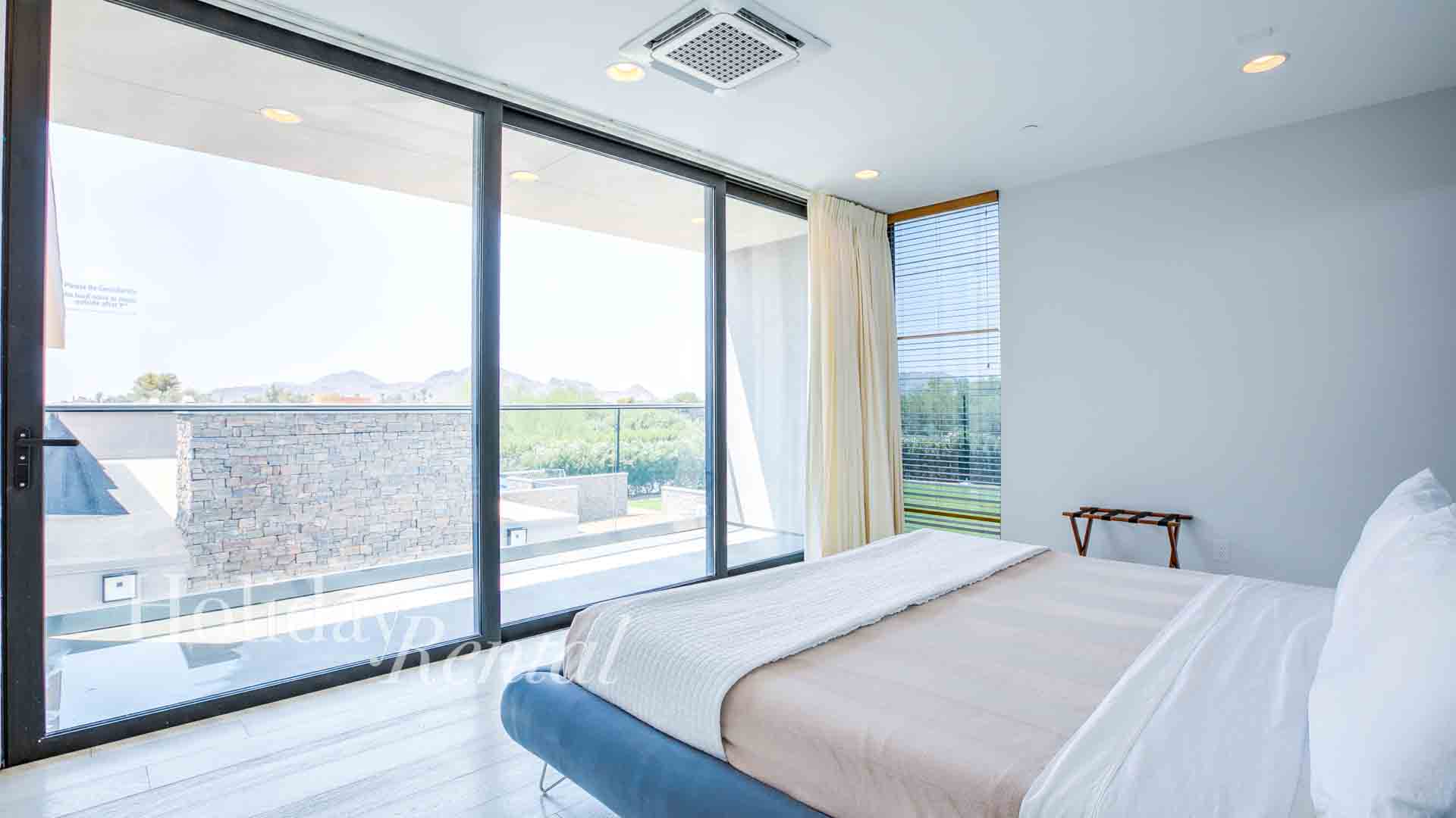 bedroom with floor to ceiling windows vacation rental