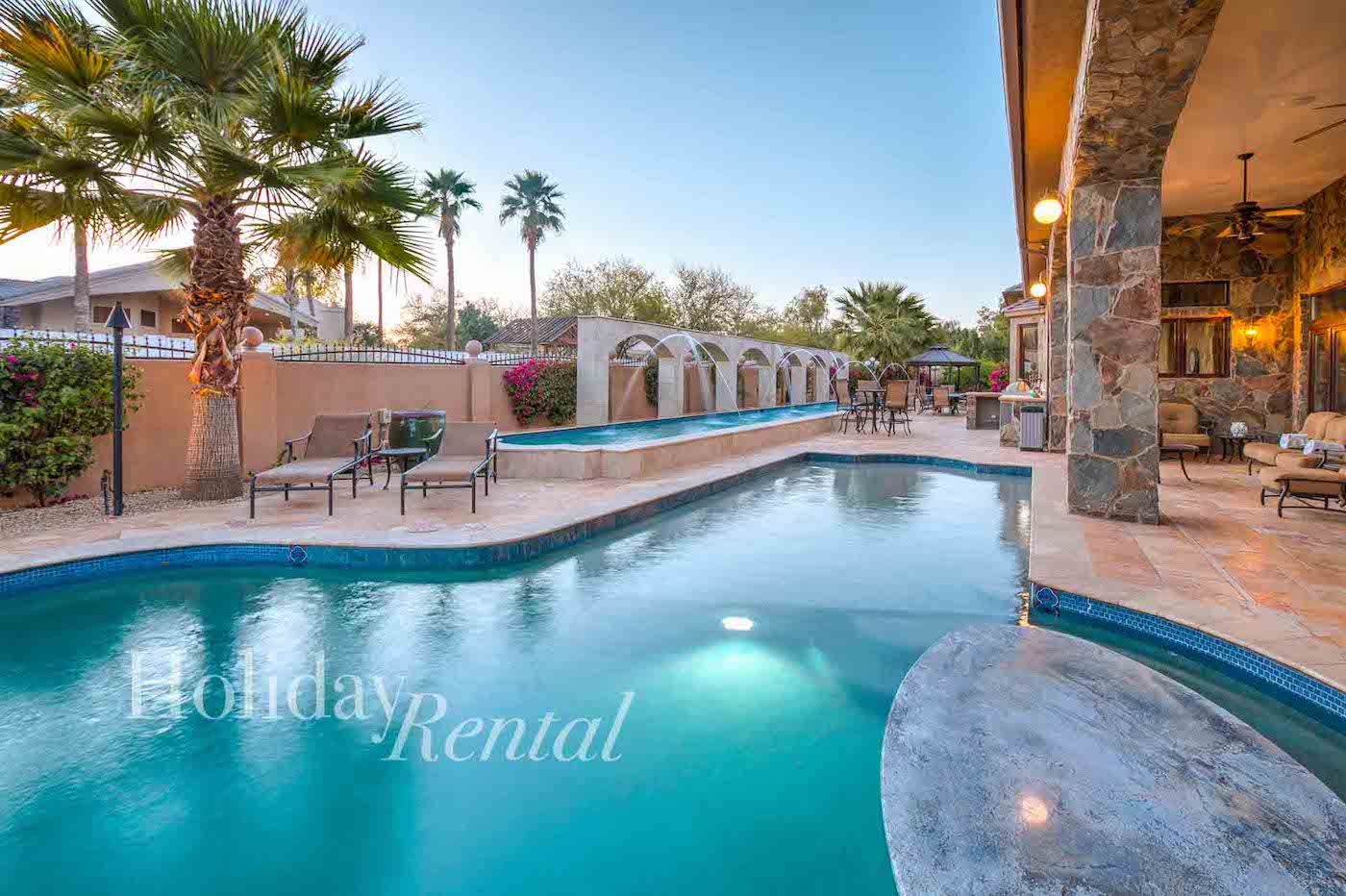vacation rental back patio with multiple pools